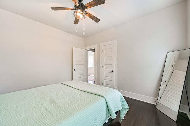 1715 30th St, Galveston, TX 77550 - bedroom featuring baseboards, dark wood finished floors, and a ceiling fan