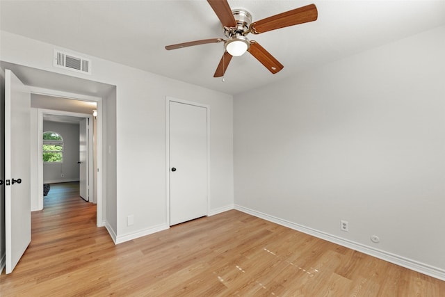 8101 Amelia Rd Unit 106, Houston, TX 77055 - unfurnished bedroom featuring light wood finished floors, baseboards, and a ceiling fan