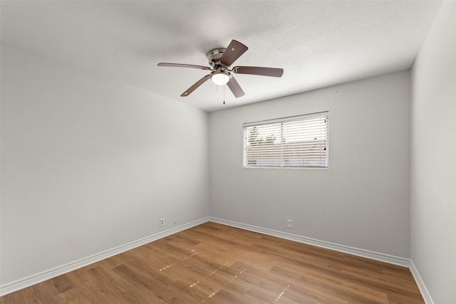 8101 Amelia Rd Unit 106, Houston, TX 77055 - empty room featuring light wood-style floors, baseboards, and a ceiling fan