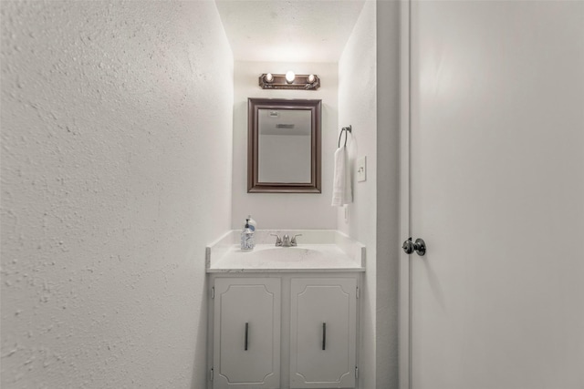 8101 Amelia Rd Unit 106, Houston, TX 77055 - bathroom with vanity and a textured wall
