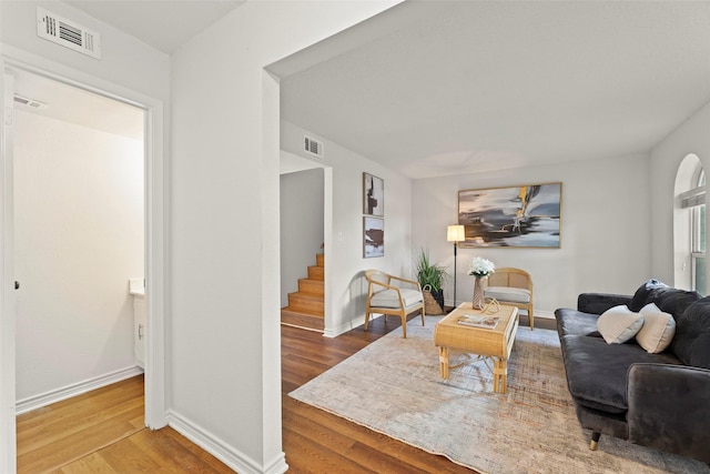 8101 Amelia Rd Unit 106, Houston, TX 77055 - living area featuring wood finished floors, baseboards, and stairway