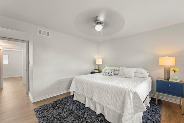 8101 Amelia Rd Unit 106, Houston, TX 77055 - bedroom featuring wood finished floors, baseboards, and ceiling fan