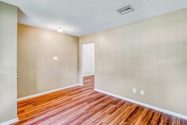 1323 W Donovan St, Houston, TX 77091 - unfurnished room with wood finished floors and baseboards