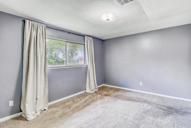 1323 W Donovan St, Houston, TX 77091 - unfurnished room featuring carpet flooring and a textured ceiling