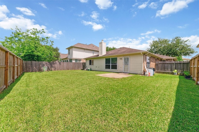8123 Solara Bnd, Houston, TX 77083 - rear view of house featuring a patio and a chimney