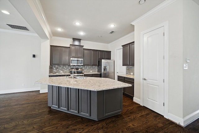 6013 Kansas St Unit B, Houston, TX 77007 - kitchen with stainless steel appliances, a sink, dark wood-style flooring, backsplash, and baseboards