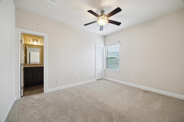 6013 Kansas St Unit B, Houston, TX 77007 - unfurnished bedroom with light colored carpet, baseboards, and ensuite bathroom