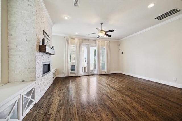 6013 Kansas St Unit B, Houston, TX 77007 - unfurnished living room with crown molding, ceiling fan, a fireplace, dark wood-style flooring, and baseboards