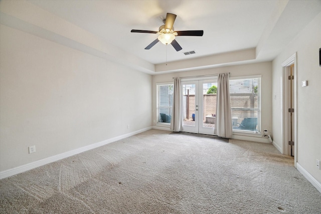 6013 Kansas St Unit B, Houston, TX 77007 - carpeted spare room featuring french doors, baseboards, a ceiling fan, and a raised ceiling