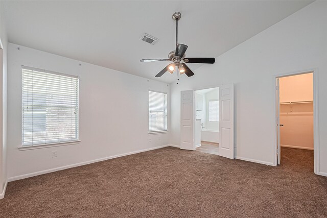 19826 Imperial Stone Dr, Houston, TX 77073 - unfurnished bedroom with carpet floors, multiple windows, a spacious closet, and baseboards
