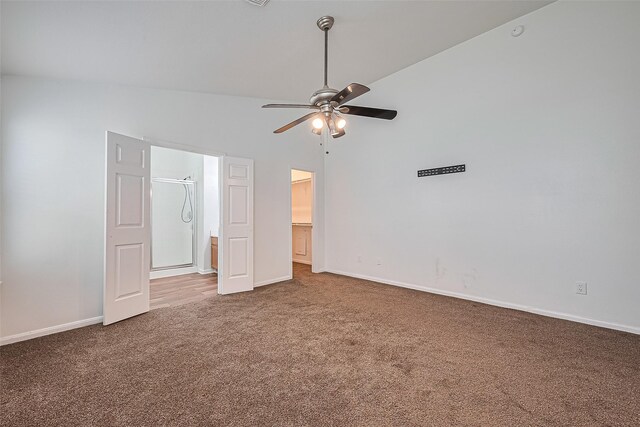 19826 Imperial Stone Dr, Houston, TX 77073 - unfurnished bedroom featuring carpet flooring, baseboards, a spacious closet, vaulted ceiling, and ensuite bath