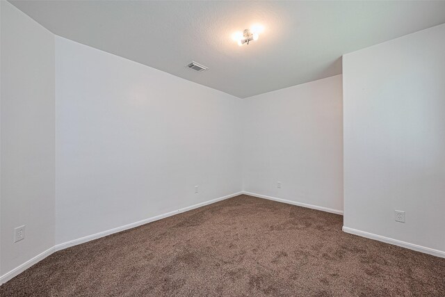 19826 Imperial Stone Dr, Houston, TX 77073 - empty room with dark carpet and baseboards