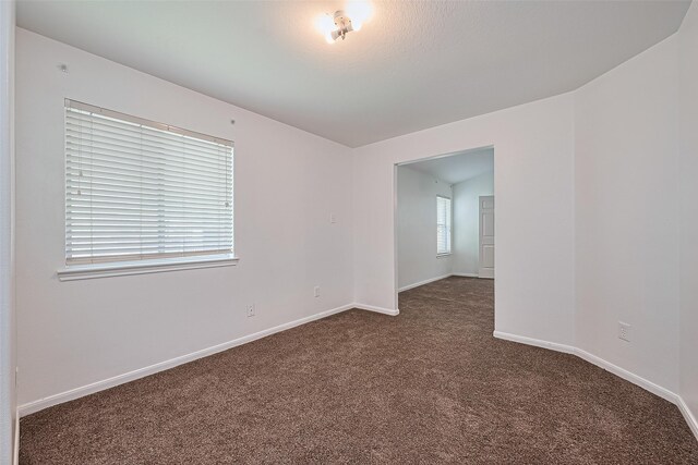 19826 Imperial Stone Dr, Houston, TX 77073 - spare room featuring carpet flooring and baseboards