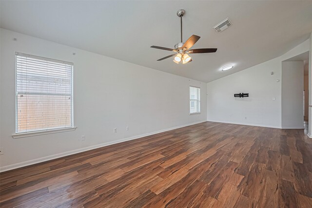 19826 Imperial Stone Dr, Houston, TX 77073 - spare room featuring lofted ceiling, dark wood-style floors, ceiling fan, and baseboards