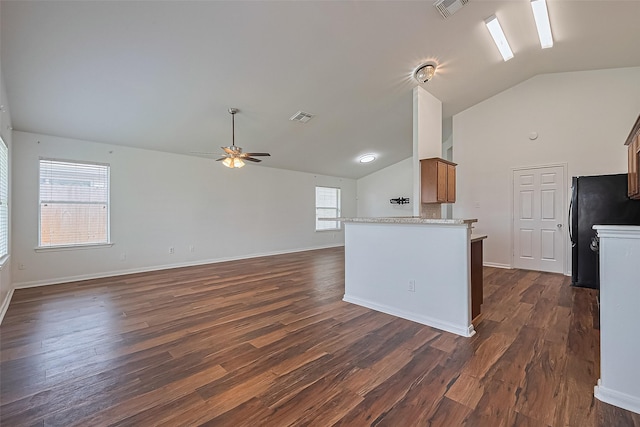 19826 Imperial Stone Dr, Houston, TX 77073 - kitchen featuring lofted ceiling, freestanding refrigerator, a ceiling fan, dark wood-style flooring, and open floor plan
