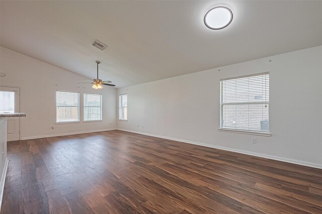 19826 Imperial Stone Dr, Houston, TX 77073 - spare room with dark wood finished floors, lofted ceiling, a ceiling fan, and baseboards