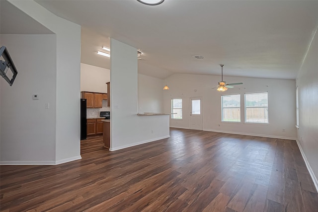 19826 Imperial Stone Dr, Houston, TX 77073 - unfurnished living room featuring lofted ceiling, a ceiling fan, baseboards, and dark wood-style flooring