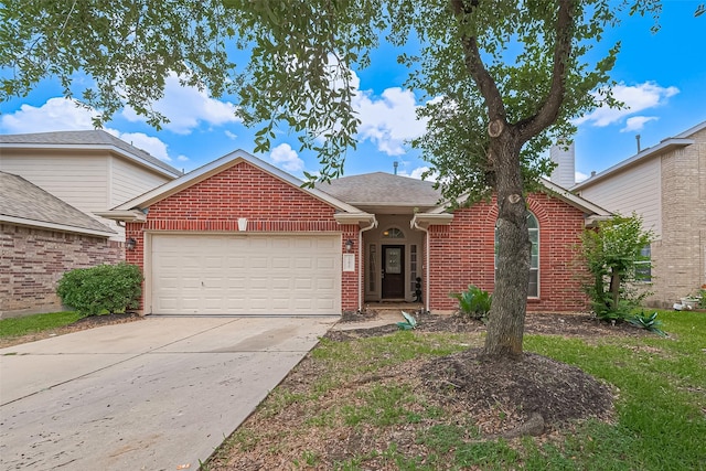 19826 Imperial Stone Dr, Houston, TX 77073 - view of front of house featuring an attached garage, concrete driveway, brick siding, and roof with shingles