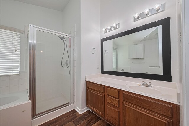 19826 Imperial Stone Dr, Houston, TX 77073 - full bath with a shower stall, wood finished floors, vanity, and a bathtub