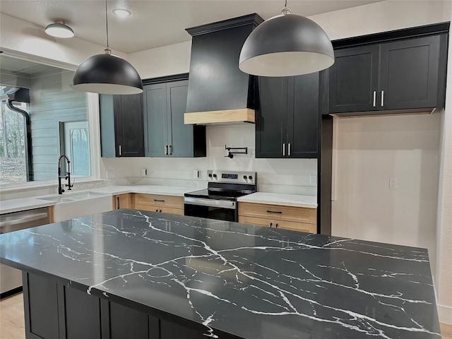 1031 Denson Allen Rd, Coldspring, TX 77331 - kitchen with stainless steel appliances, a sink, dark cabinetry, and light stone counters