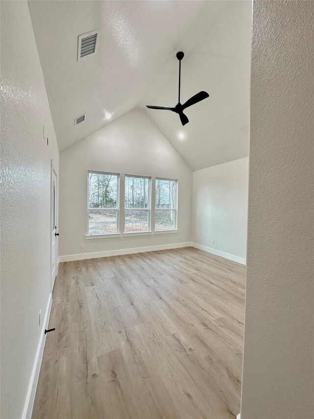 1031 Denson Allen Rd, Coldspring, TX 77331 - unfurnished room with ceiling fan, light wood-style flooring, baseboards, and lofted ceiling