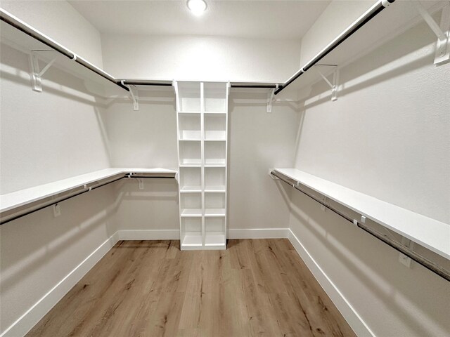 1031 Denson Allen Rd, Coldspring, TX 77331 - walk in closet featuring light wood finished floors