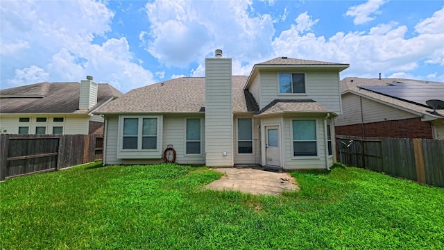 38107 W Sulphur Creek Dr, Magnolia, TX 77355 - back of house with a chimney, a shingled roof, and a patio area