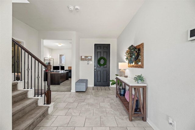 1435 Wheatley Hill Ln, Katy, TX 77494 - entrance foyer featuring stairway, baseboards, and light tile patterned floors