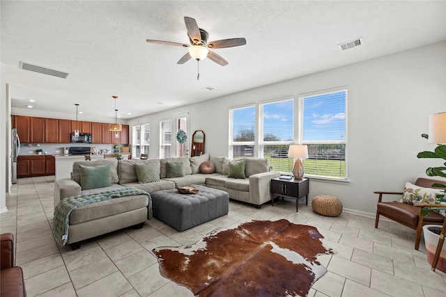 1435 Wheatley Hill Ln, Katy, TX 77494 - living room featuring plenty of natural light, ceiling fan, baseboards, light tile patterned floors, and recessed lighting