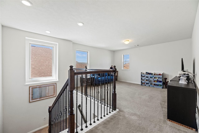 1435 Wheatley Hill Ln, Katy, TX 77494 - hall with an upstairs landing, carpet, baseboards, and recessed lighting