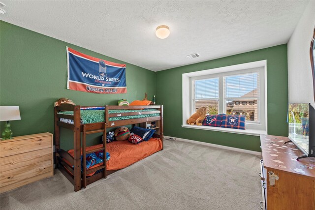 1435 Wheatley Hill Ln, Katy, TX 77494 - carpeted bedroom with a textured ceiling and baseboards
