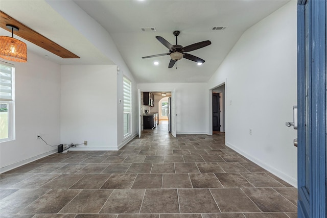 719 Shaver St, Pasadena, TX 77506 - empty room featuring a ceiling fan, lofted ceiling, and arched walkways
