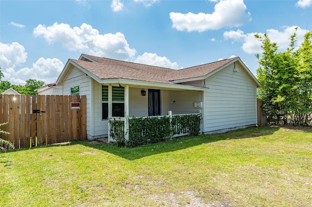 719 Shaver St, Pasadena, TX 77506 - view of front facade with roof with shingles, a gate, and covered porch