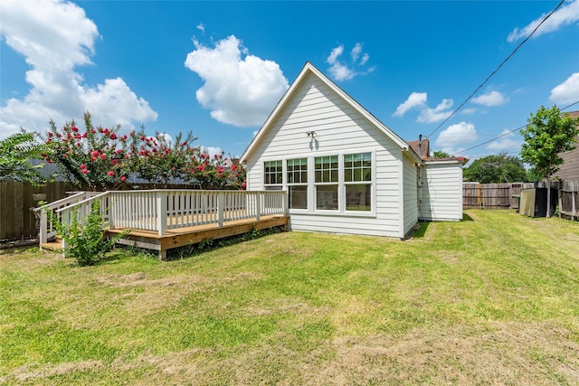 719 Shaver St, Pasadena, TX 77506 - rear view of property with a fenced backyard and a wooden deck