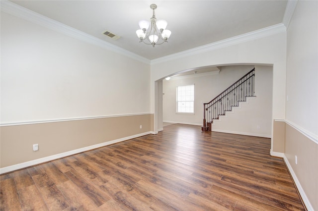 14410 Basalt Ln, Houston, TX 77077 - spare room with arched walkways, a chandelier, wood finished floors, and crown molding
