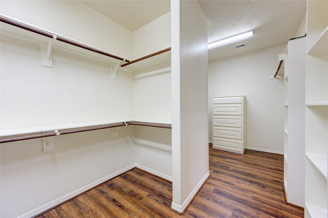 14410 Basalt Ln, Houston, TX 77077 - walk in closet with wood finished floors