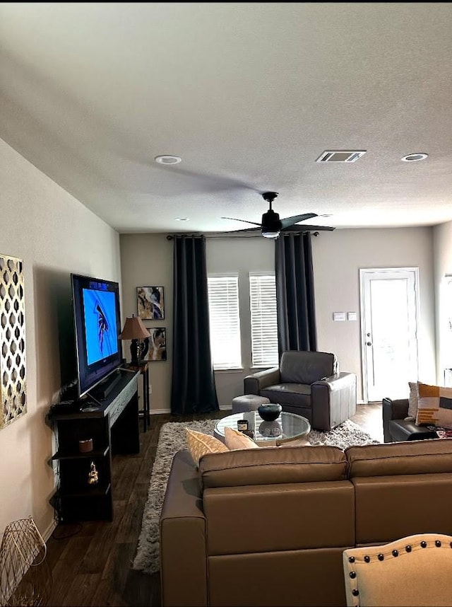 14710 Blackbrush Mnr, Magnolia, TX 77354 - living area with dark wood-style floors, baseboards, and ceiling fan