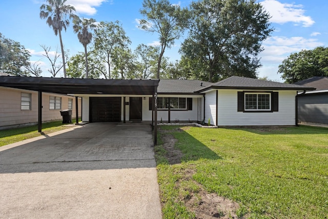 2319 Helena Ave, Nederland, TX 77627 - single story home with concrete driveway, a garage, a carport, and a front yard