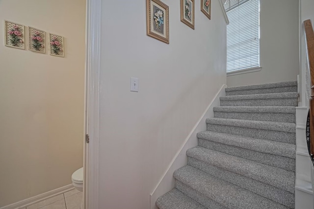 14723 Belterraza Dr, Houston, TX 77083 - staircase with tile patterned flooring and baseboards