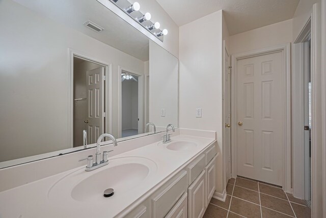 14723 Belterraza Dr, Houston, TX 77083 - full bath with double vanity and tile patterned flooring