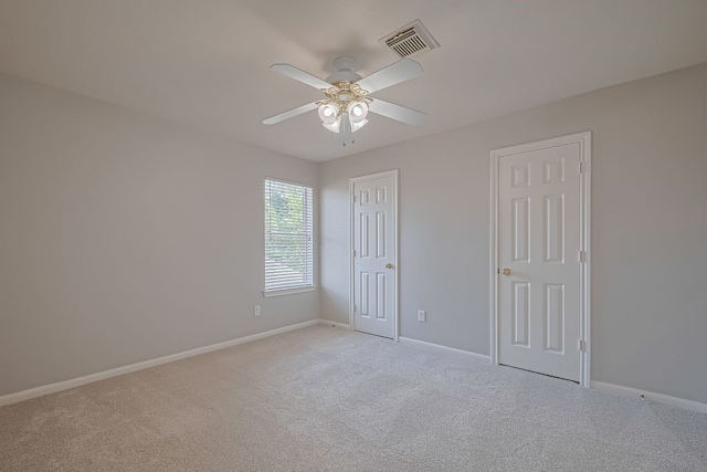 14723 Belterraza Dr, Houston, TX 77083 - unfurnished bedroom with light colored carpet, baseboards, a ceiling fan, and a closet