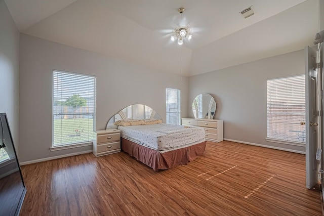 14723 Belterraza Dr, Houston, TX 77083 - bedroom featuring wood finished floors, baseboards, vaulted ceiling, and ceiling fan