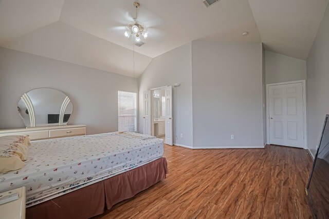 14723 Belterraza Dr, Houston, TX 77083 - bedroom featuring vaulted ceiling, light wood-style flooring, baseboards, ensuite bath, and a ceiling fan