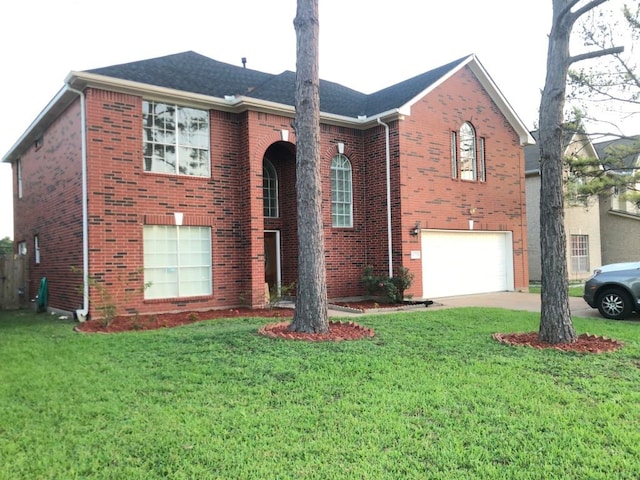14723 Belterraza Dr, Houston, TX 77083 - view of front facade with an attached garage, brick siding, driveway, and a front lawn