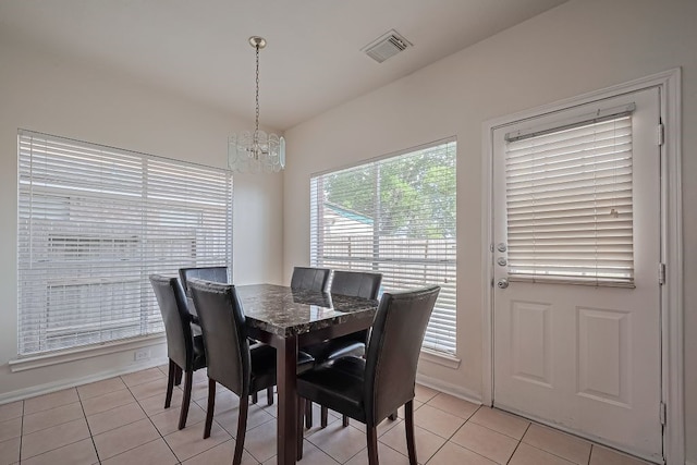 14723 Belterraza Dr, Houston, TX 77083 - dining room with a chandelier and light tile patterned floors