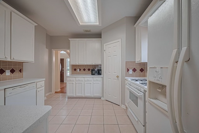 14723 Belterraza Dr, Houston, TX 77083 - kitchen featuring white appliances, tasteful backsplash, light countertops, and white cabinetry