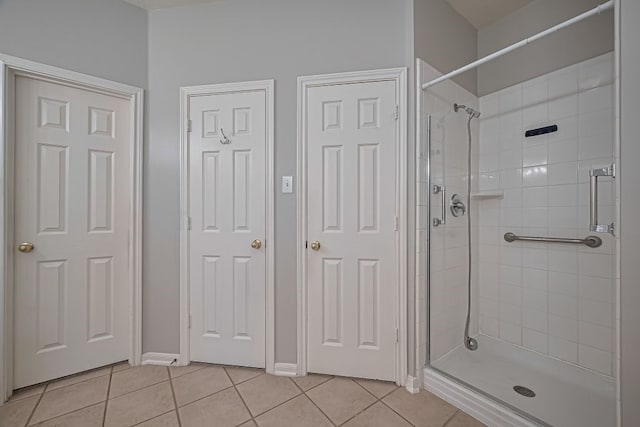 14723 Belterraza Dr, Houston, TX 77083 - full bath featuring tile patterned floors, a shower stall, and baseboards