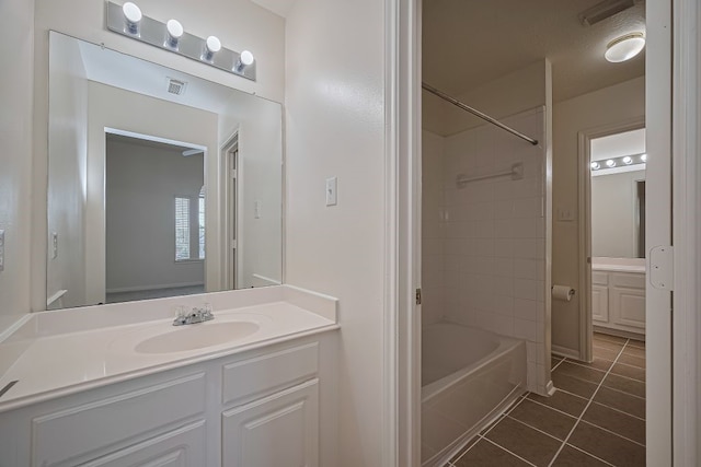 14723 Belterraza Dr, Houston, TX 77083 - bathroom with tile patterned flooring, vanity, and bathing tub / shower combination