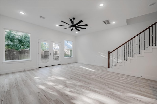 7002 Sidney St, Houston, TX 77021 - unfurnished living room with healthy amount of natural light, a ceiling fan, french doors, light wood-type flooring, and recessed lighting