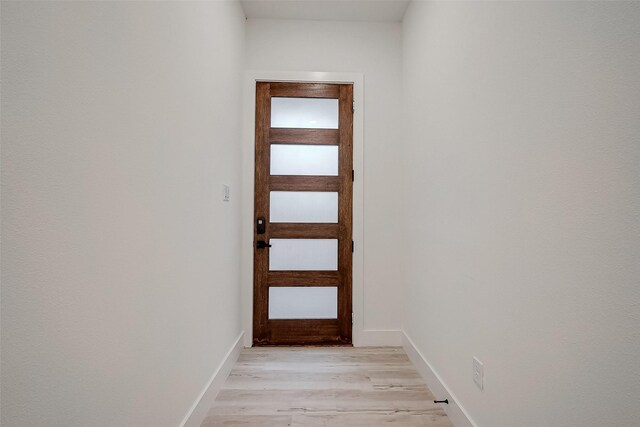 7002 Sidney St, Houston, TX 77021 - entryway featuring light wood-style flooring and baseboards